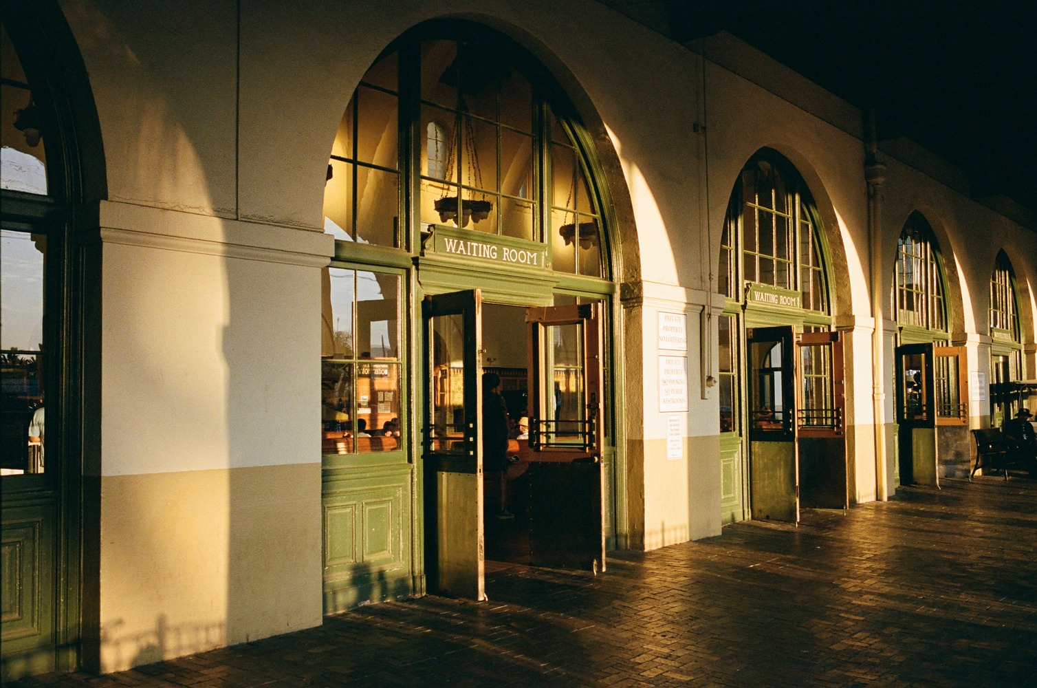 A photo shows the entrance to a waiting room at an Amtrak station in San Diego, CA.